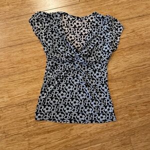 Black white R initial flower print glittery cap sleeve semi sheer blouse